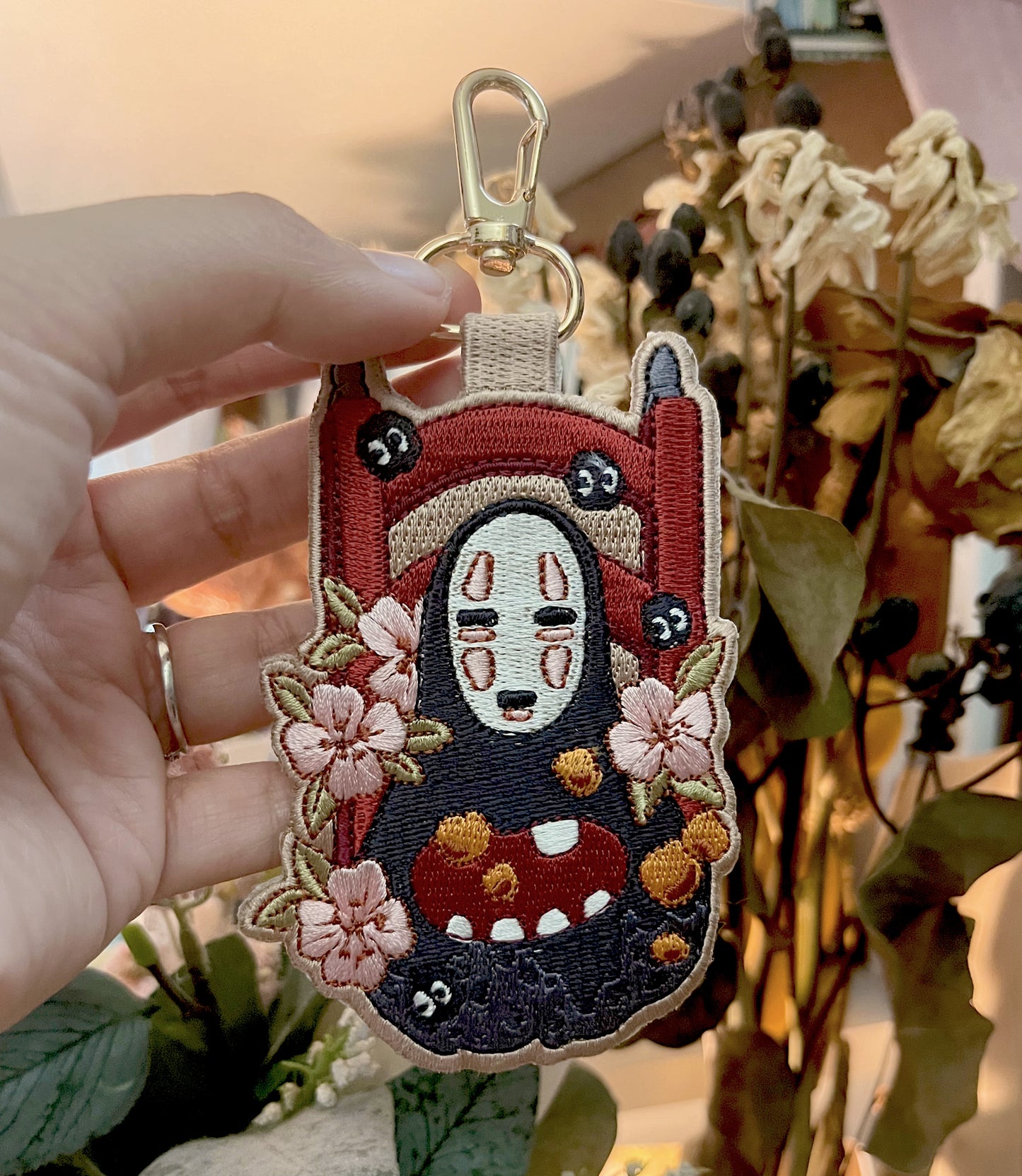 NO FACE EMBROIDERED KEYCHAIN