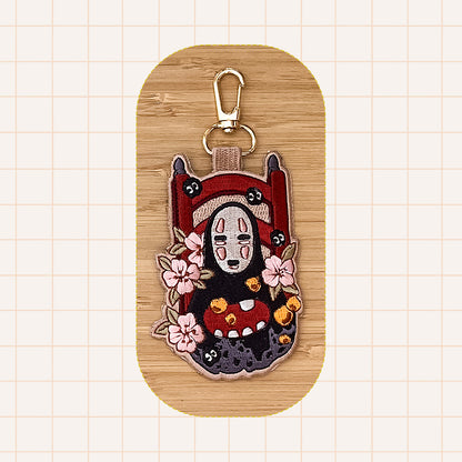 NO FACE EMBROIDERED KEYCHAIN